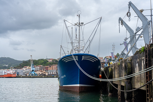 Boat in the port of the town of Pasajes in the San Sebastian region. Basque Country . Spain. August 3, 2023.