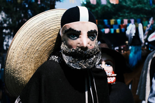 Portrait of young parachico (traditional mexican dancer) outdoors