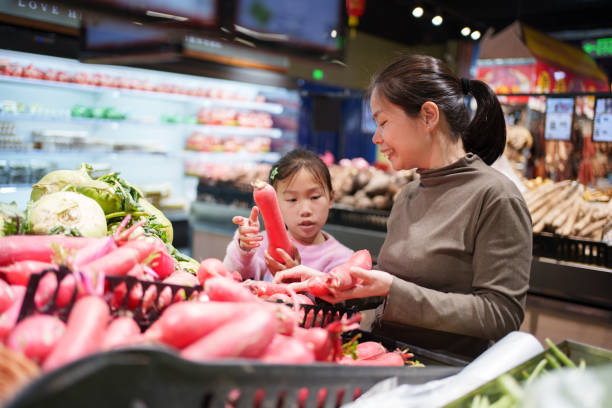 Mother and daughter picking radishes