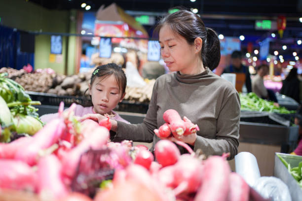 woman buying vegetables