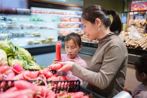 Mother and daughter picking radishes