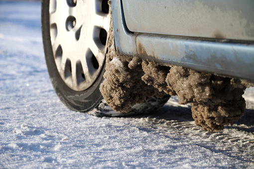 Frozen slush on the bottom of the car, vehicle has been driven on potentially muddy or unpaved roads