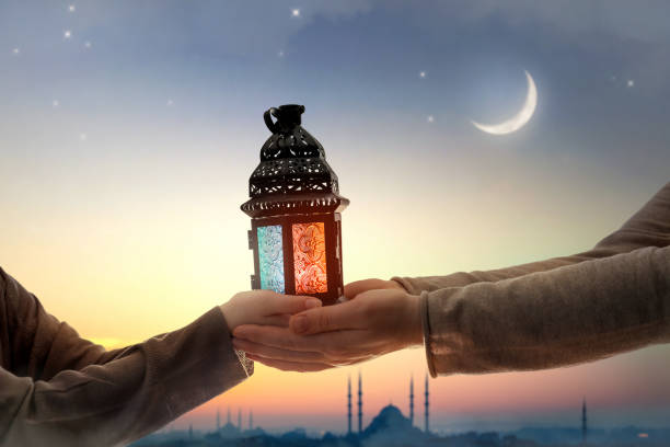 istock Ornamental Arabic lantern with burning candle 2024245944