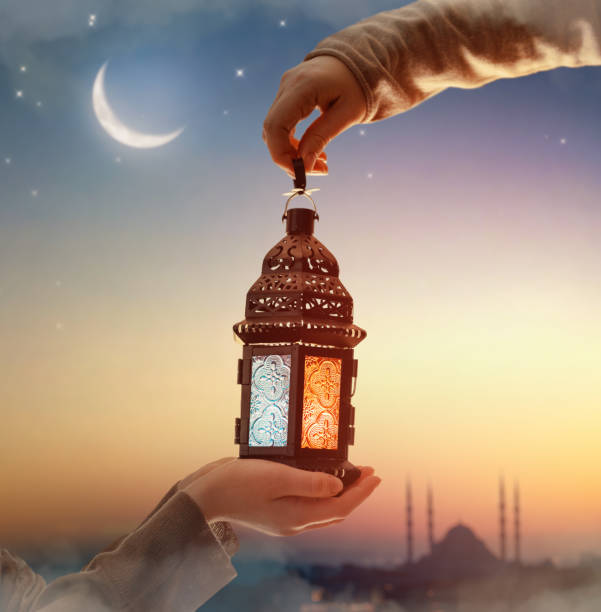 istock Ornamental Arabic lantern with burning candle 2024245946