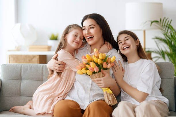 istock daughters and mom with flowers 2024271425