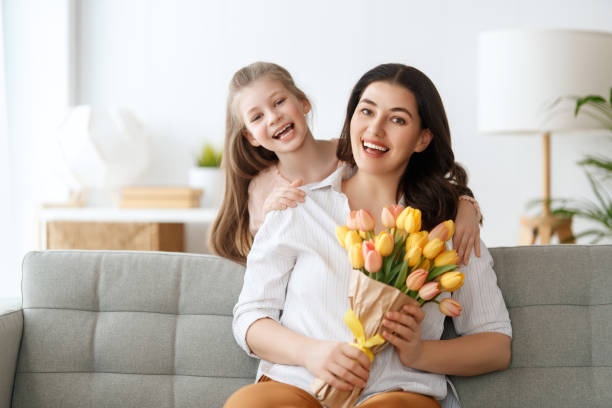 istock daughter and mom with flowers 2024271432
