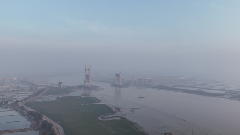 Early morning, aerial video of the under construction cross sea bridge