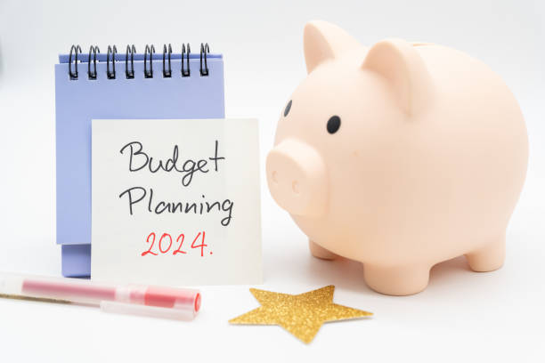 istock Budget Planning 2024 text message by hand writing on paper note, Calendar, Golden Star and Piggy bank. Budget planning concept. 2024290497