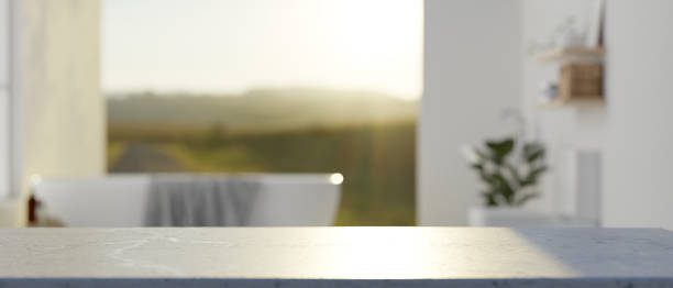istock A white tabletop with empty space with a blurred background of a luxury bathroom with bathtub. 2024304925