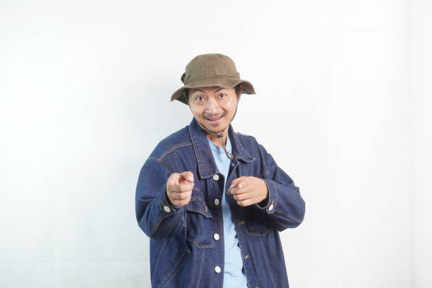 Studio shot of a young man with challenging gesture
