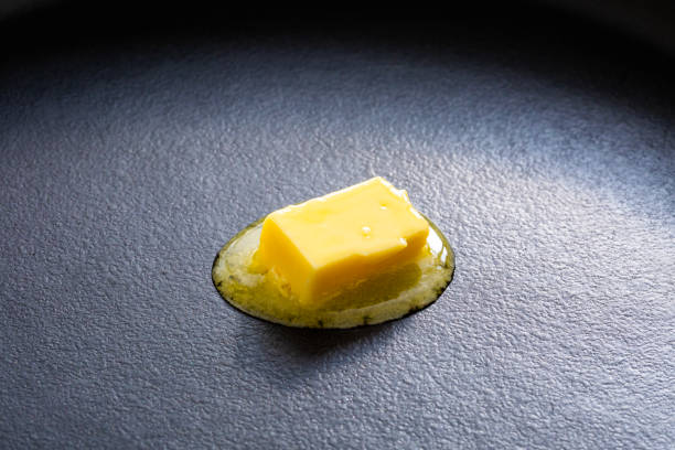 Melting butter and cooking in a Teflon-treated frying pan