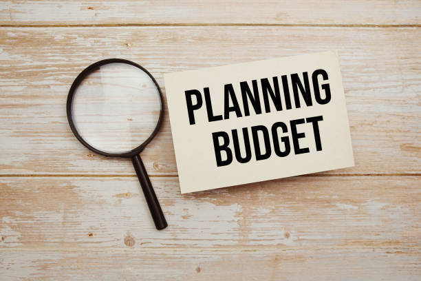 istock Planning Budget text message and magnifying glass with space copy on wooden background 2024470158