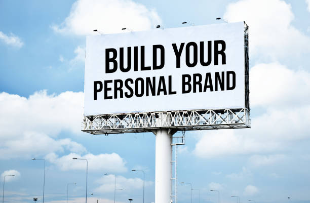 istock Build Your Personal Brand text message on signboard with blue sky 2024472278