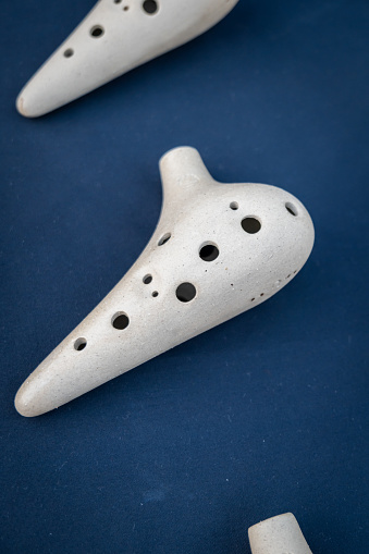 Ocarina on display, a traditional wind musical instrument, close-up with selective focus