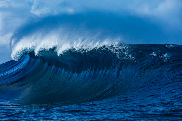 istock Large blue wave breaking in the open ocean over a shallow reef bombora 2024522998