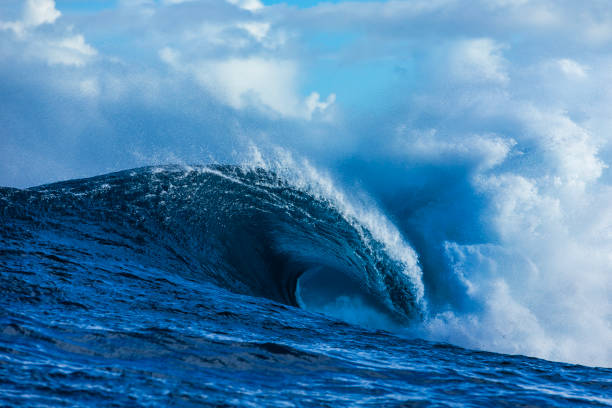 istock Large blue wave breaking in the open ocean over a shallow reef bombora 2024525575