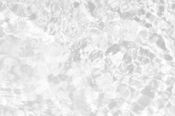 istock White water surface texture with ripples, splashes, and bubbles. Abstract summer banner background Water waves in sunlight with copy space cosmetic moisturizer micellar toner emulsion. White water. 2024529247