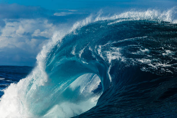 istock Close up to powerful blue wave breaking in the open ocean over a shallow reef bombora 2024530256