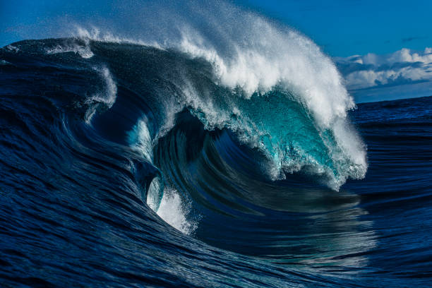 istock Close up to powerful foamy wave surging over a shallow reef bombora 2024562444