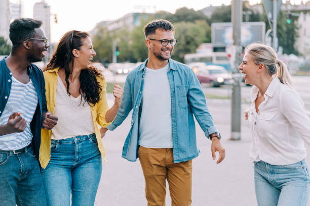 istock Friends having fun outdoors in the city. 2024565654