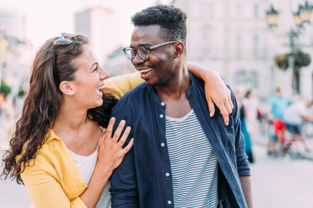 istock Happy couple hugging outdoors. 2024565659