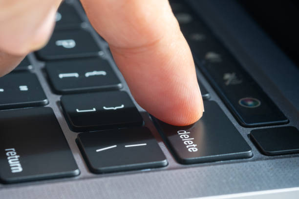 istock Finger of the computer user, he presses the delete button on the computer keyboard. 2024569369