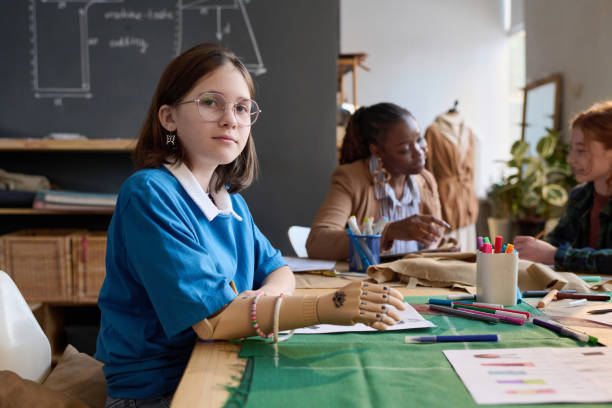istock Girl with prosthetic hand in tailoring class 2024598654