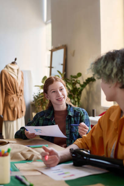 istock Girls chatting in tailoring class 2024599768