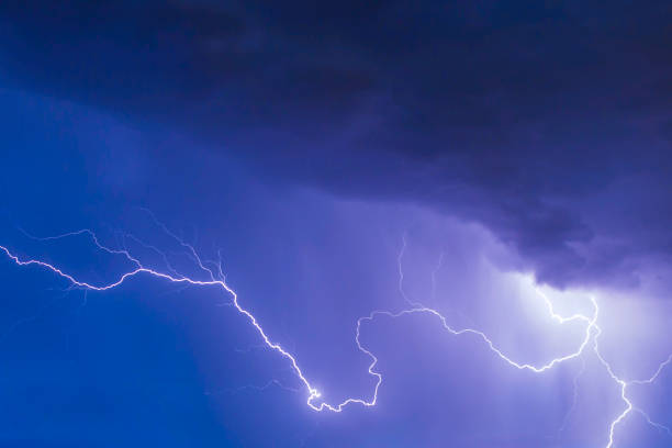 istock beautiful lightning during a thunderstorm at night in a forest that caused a fire, against a dark sky with rain 2024645292
