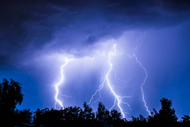 istock beautiful lightning during a thunderstorm at night in a forest that caused a fire, against a dark sky with rain 2024649543