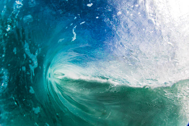 istock Inside of a blue wave breaking at the beach on a sunny day 2024650265