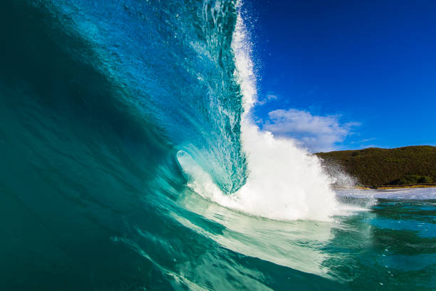 istock Beneath a blue wave breaking at the beach on a sunny day 2024652828