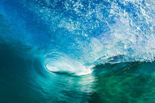 istock Beneath a blue wave breaking at the beach on a sunny day 2024658211