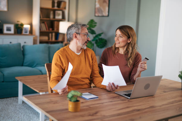 istock Shot of a gentle couple using a laptop while doing their budget work in their dining room at home 2024665667