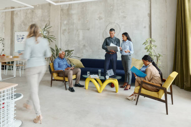 istock Group of mixed-race business people working in a hallway. 2024667797