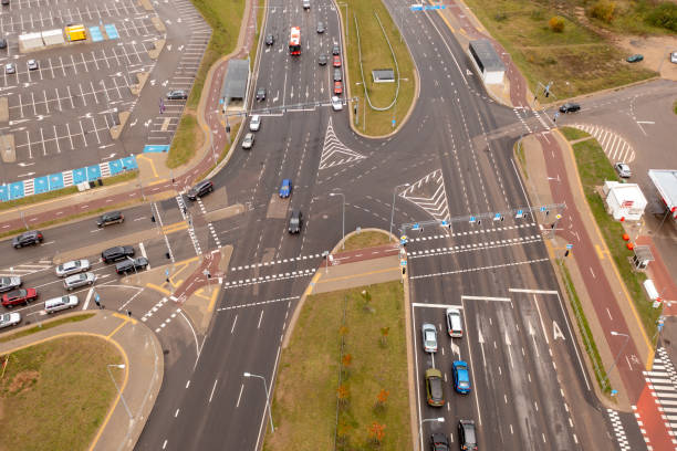 istock Drone photography of multiple lane intersection with traffic during autumn day 2024672718