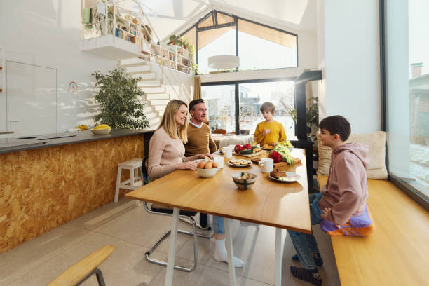 istock Happy family talking during a meal at dining table. 2024693178