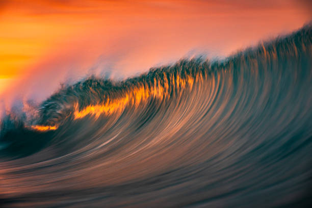 istock Motion blur of smooth ocean wave breaking in golden light 2024707260