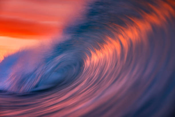 istock Motion blur of smooth ocean wave breaking in golden light 2024708847