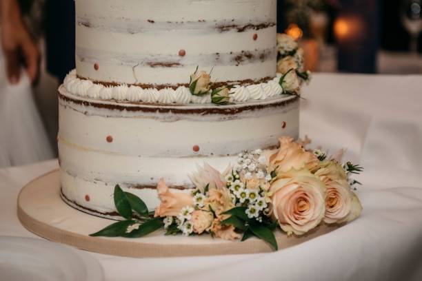 istock Closeup of a wedding cake adorned with flowers 2024749866