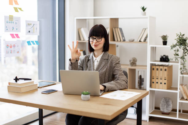istock Caucasian female worker investigating trademarks using search engine. 2024764359