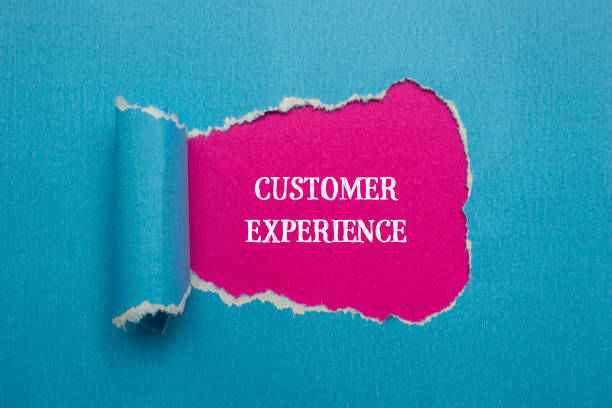 istock Customer experience words written on blue torn paper with pink background 2024769896