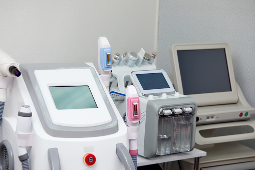 Skin Treatment Laser Equipment. Medical Worker Sets Indices On Screen Of Laser for cosmetic procedures. Close up of Beauty Machine In Cosmetology Center, Beauty Salon. Selective focus.