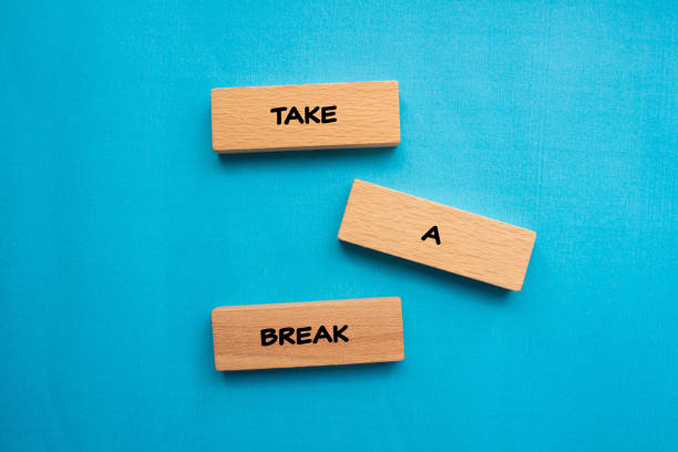 istock Take a break words written on wooden blocks with blue background 2024771580