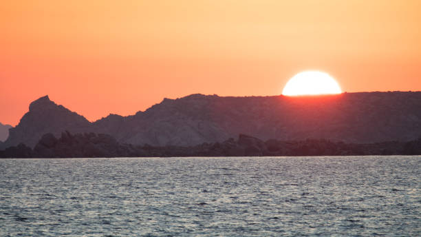 The sun rising over the promontory of Punta Falcone, near Santa Teresa Gallura.