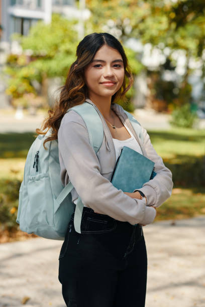istock Smiling Girl with Books in Hands 2024825347