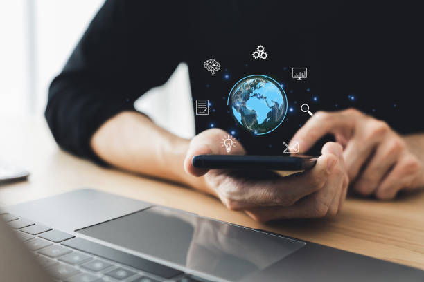 istock Man using smartphone and laptop. Working on cyberspace network connection, global business intelligence data and information, internet of thing transformation platform service. Work from home concept 2024839990