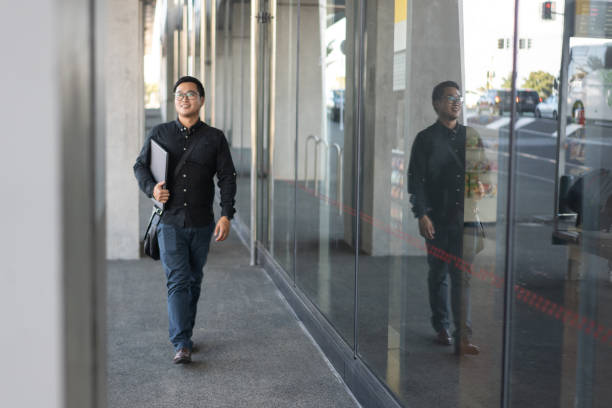 istock Confident Asian Young Professional Walking in a City 2024847740