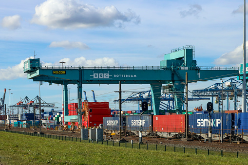 Container cranes in the Waalhaven harbor of the Port of Rotterdam Netherlands