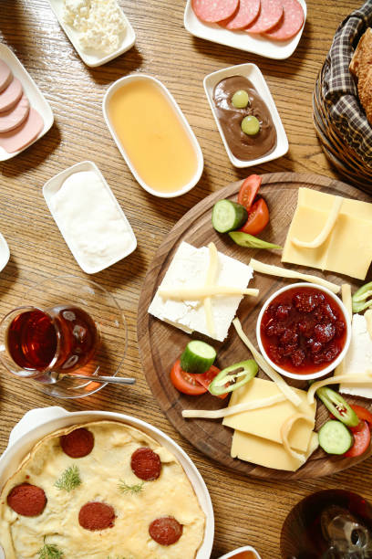 istock Wooden Table Adorned With Food Plates 2024896207